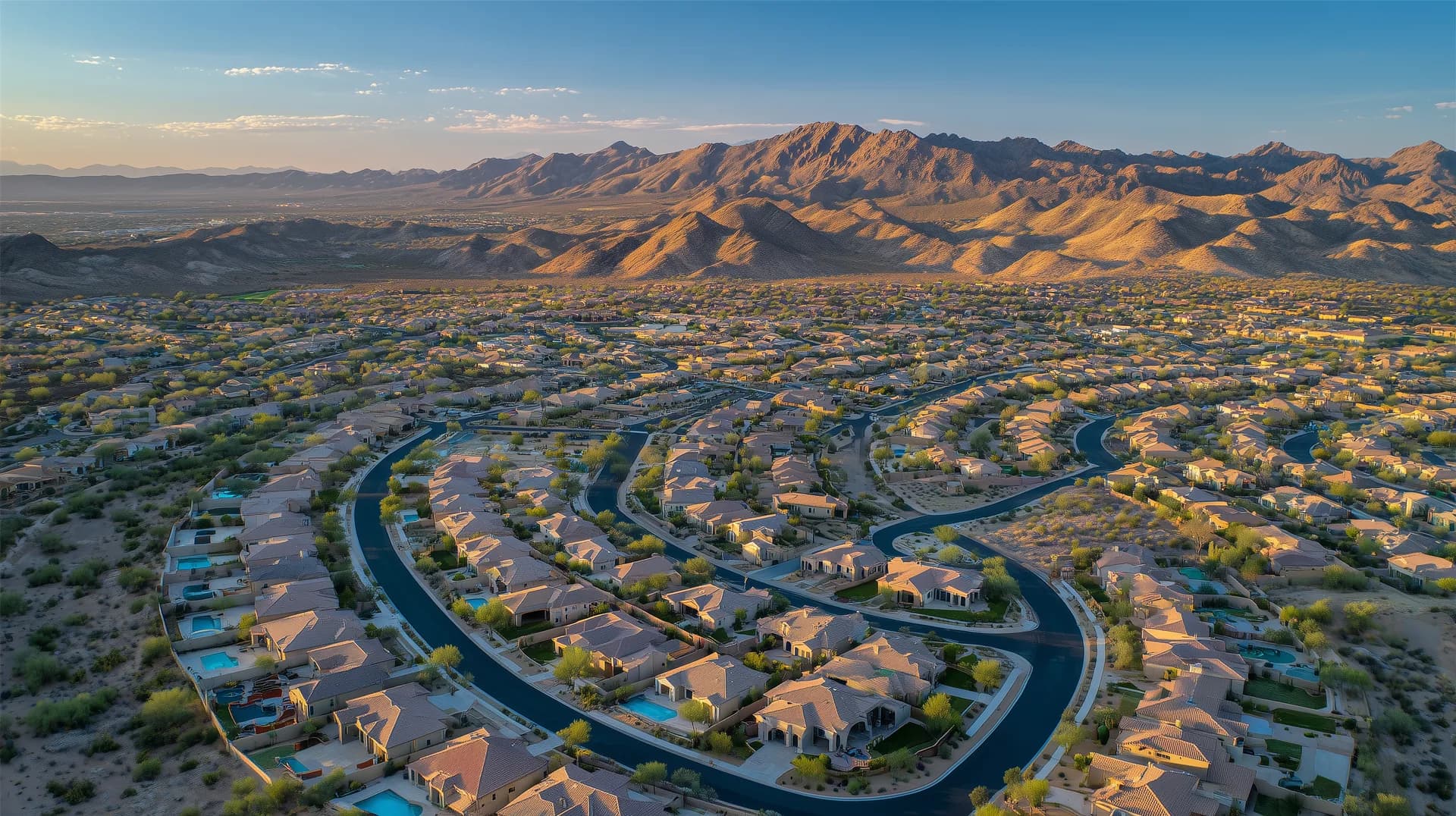 Aerial view of a new master-planned community in the Phoenix metro with mountains in background