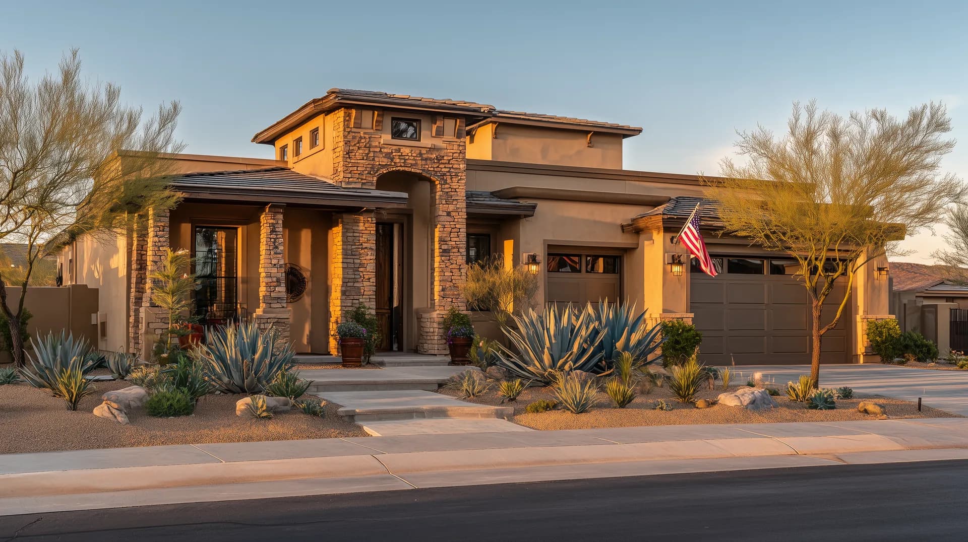 New construction home in a Phoenix suburb at golden hour with American flag flying from garage