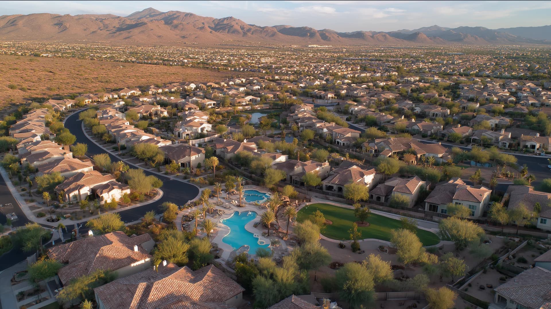 Aerial drone view of a Phoenix metro master-planned community with pool amenity center